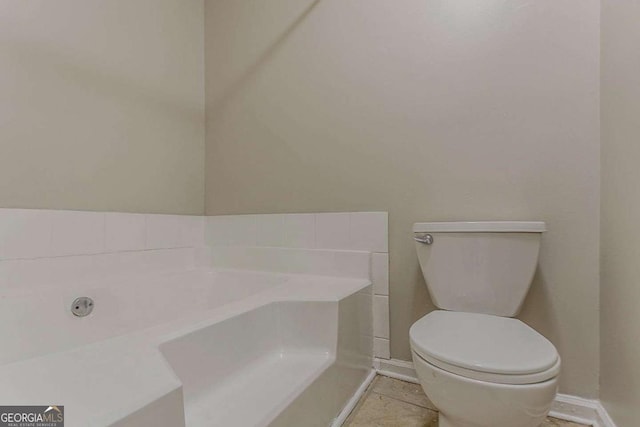 1074 Cherokee Hts, Stone Mountain, GA 30083 - bathroom featuring a bath and tile patterned flooring
