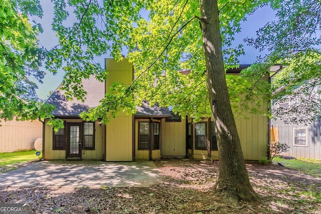 1074 Cherokee Hts, Stone Mountain, GA 30083 - back of house featuring roof with shingles