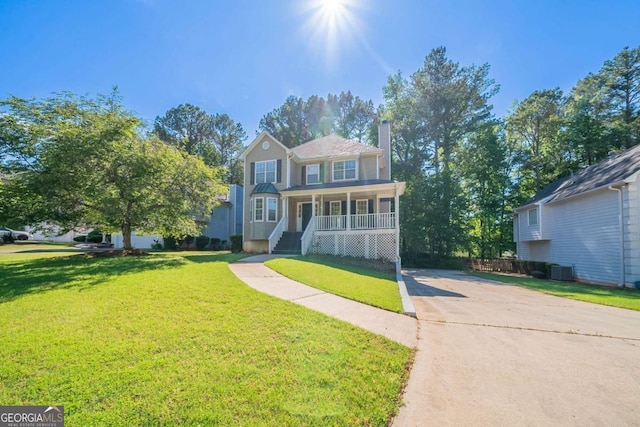 12237 Cypress Ln, Fayetteville, GA 30215 - traditional home featuring covered porch, a chimney, concrete driveway, and a front yard
