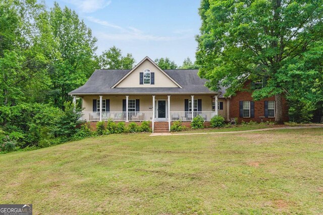 418 Whisper Wood Way, Locust Grove, GA 30248 - farmhouse with covered porch and a front yard