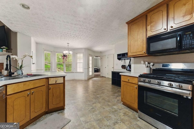 418 Whisper Wood Way, Locust Grove, GA 30248 - kitchen with black microwave, stainless steel gas stove, a sink, brown cabinets, and a textured ceiling