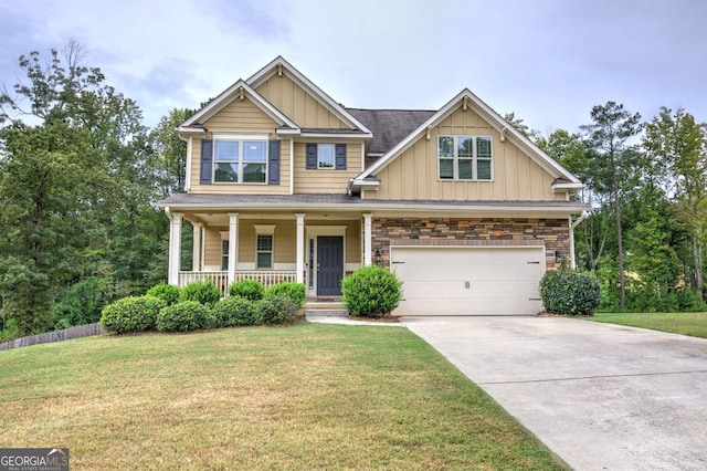 138 Gorham Gates Dr, Hiram, GA 30141 - craftsman house featuring board and batten siding, an attached garage, covered porch, concrete driveway, and a front lawn