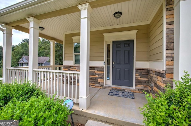 138 Gorham Gates Dr, Hiram, GA 30141 - view of exterior entry featuring covered porch and stone siding