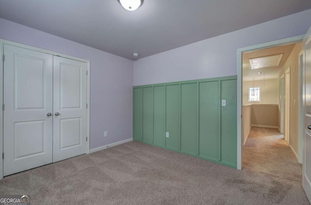 138 Gorham Gates Dr, Hiram, GA 30141 - unfurnished bedroom with carpet floors, attic access, and a closet