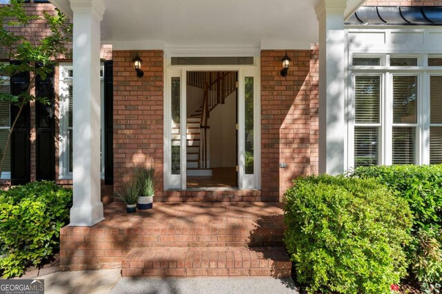 1575 Wynridge Pointe, Alpharetta, GA 30005 - property entrance featuring a porch and brick siding