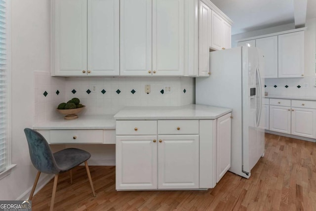 1575 Wynridge Pointe, Alpharetta, GA 30005 - kitchen with decorative backsplash, light wood finished floors, white cabinets, and light countertops