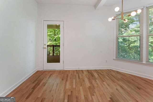 1575 Wynridge Pointe, Alpharetta, GA 30005 - empty room with a chandelier, wood finished floors, and baseboards