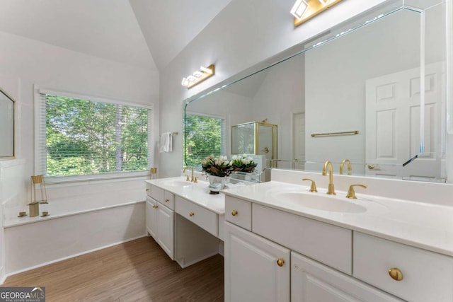 1575 Wynridge Pointe, Alpharetta, GA 30005 - full bath featuring vaulted ceiling, a stall shower, healthy amount of natural light, wood finished floors, and a garden tub