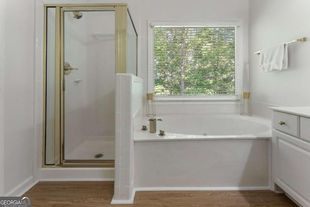 1575 Wynridge Pointe, Alpharetta, GA 30005 - bathroom with a shower stall, vanity, a garden tub, and wood finished floors