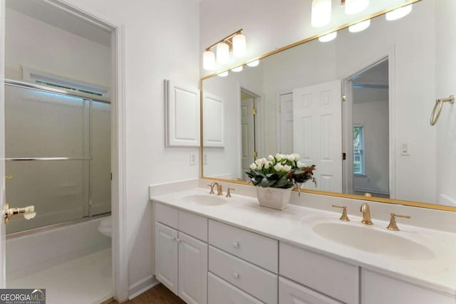 1575 Wynridge Pointe, Alpharetta, GA 30005 - full bath featuring double vanity, toilet, and combined bath / shower with glass door