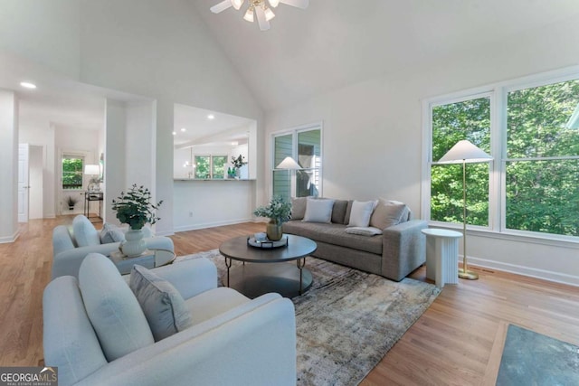 1575 Wynridge Pointe, Alpharetta, GA 30005 - living area featuring healthy amount of natural light, baseboards, high vaulted ceiling, and a ceiling fan