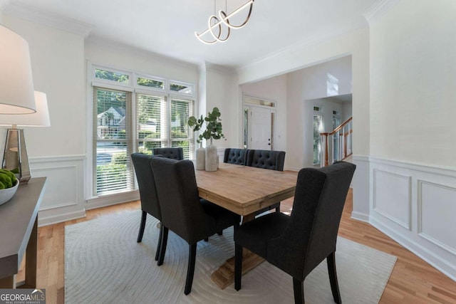 1575 Wynridge Pointe, Alpharetta, GA 30005 - dining space with ornamental molding, a chandelier, light wood-type flooring, a decorative wall, and stairway