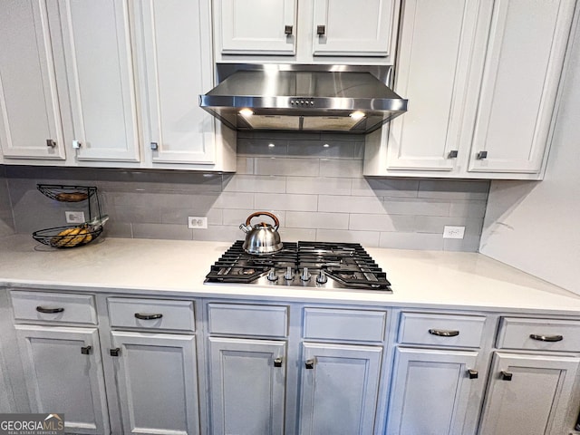 7860 Bristol Valley Dr, Cumming, GA 30028 - kitchen with extractor fan, stainless steel gas stovetop, backsplash, and light countertops
