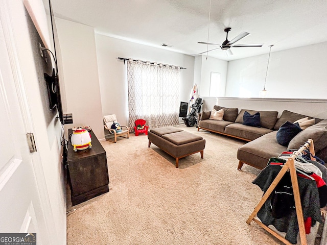 7860 Bristol Valley Dr, Cumming, GA 30028 - carpeted living room with a ceiling fan