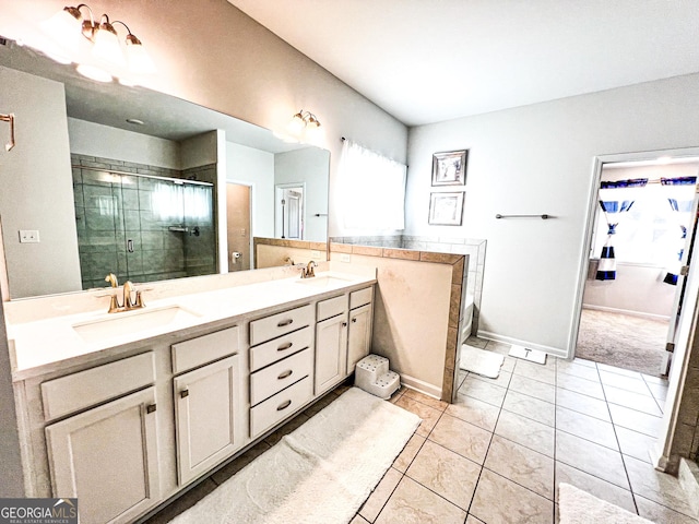 7860 Bristol Valley Dr, Cumming, GA 30028 - bathroom with a shower stall, double vanity, tile patterned floors, and baseboards