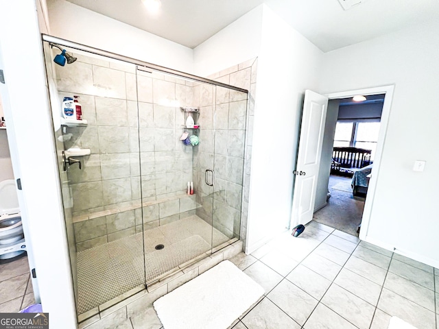 7860 Bristol Valley Dr, Cumming, GA 30028 - full bath with a shower stall, tile patterned floors, and baseboards