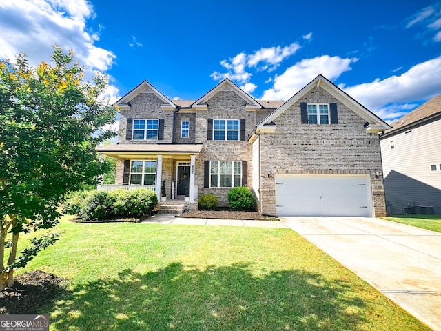 7860 Bristol Valley Dr, Cumming, GA 30028 - traditional home with driveway, an attached garage, a front lawn, and brick siding