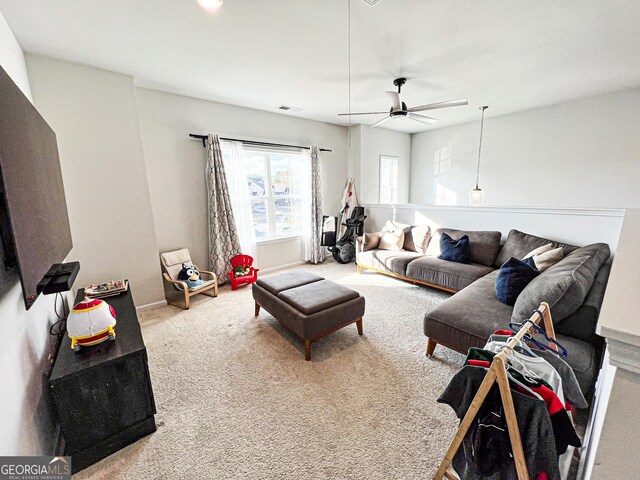 7860 Bristol Valley Dr, Cumming, GA 30028 - living room featuring carpet, ceiling fan, and baseboards
