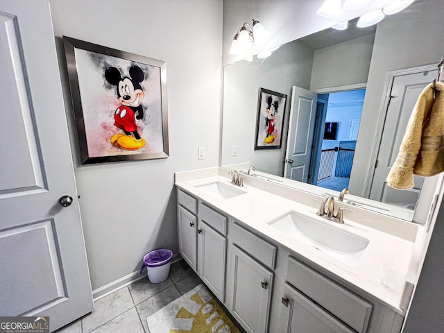 7860 Bristol Valley Dr, Cumming, GA 30028 - bathroom with double vanity, tile patterned flooring, and baseboards