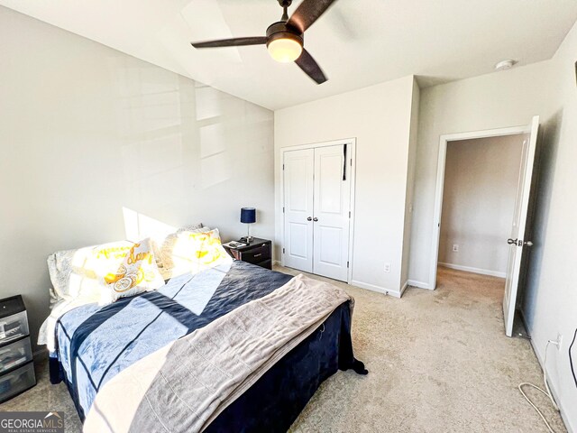 7860 Bristol Valley Dr, Cumming, GA 30028 - bedroom featuring light carpet, a closet, baseboards, and a ceiling fan