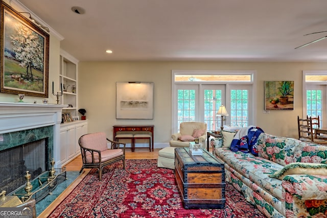 174 Leighs Xing, Cleveland, GA 30528 - living area featuring wood finished floors, a fireplace, recessed lighting, baseboards, and built in features