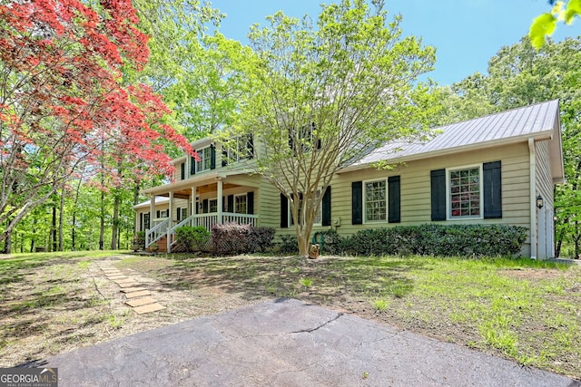 174 Leighs Xing, Cleveland, GA 30528 - view of front of house featuring covered porch, a balcony, and metal roof
