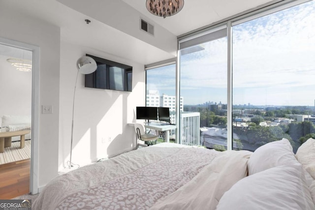 3324 Peachtree Rd NE Unit 1304, Atlanta, GA 30326 - bedroom with floor to ceiling windows and wood finished floors
