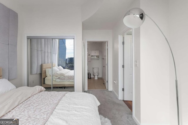 3324 Peachtree Rd NE Unit 1304, Atlanta, GA 30326 - bedroom with carpet floors, baseboards, and ensuite bathroom