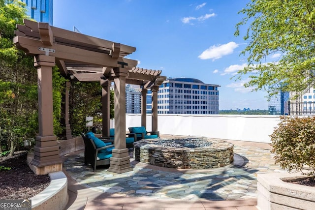 3324 Peachtree Rd NE Unit 1304, Atlanta, GA 30326 - view of patio featuring an outdoor fire pit, a pergola, and a city view