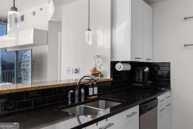 3324 Peachtree Rd NE Unit 1304, Atlanta, GA 30326 - kitchen with dishwasher, tasteful backsplash, a sink, and white cabinetry