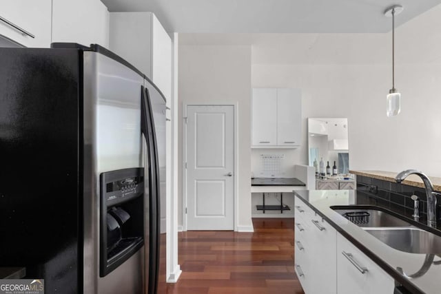 3324 Peachtree Rd NE Unit 1304, Atlanta, GA 30326 - kitchen with stainless steel fridge, a sink, dark wood finished floors, white cabinets, and hanging light fixtures