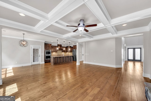 859 Heritage Lake Way, Grayson, GA 30017 - unfurnished living room with a chandelier, a ceiling fan, hardwood / wood-style flooring, beamed ceiling, and coffered ceiling