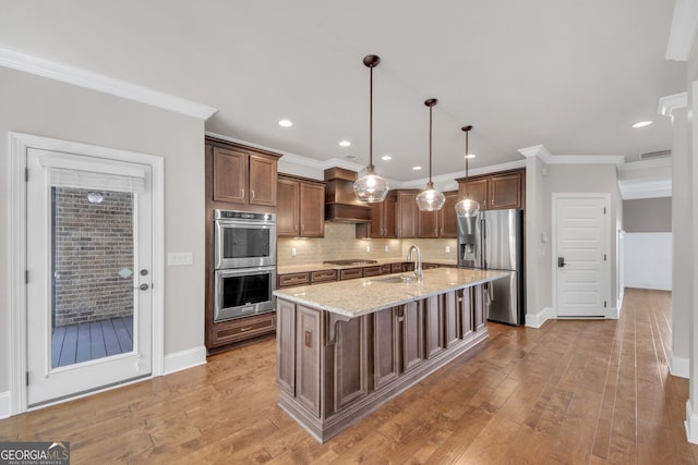 859 Heritage Lake Way, Grayson, GA 30017 - kitchen featuring stainless steel appliances, a sink, ornamental molding, light stone counters, and backsplash