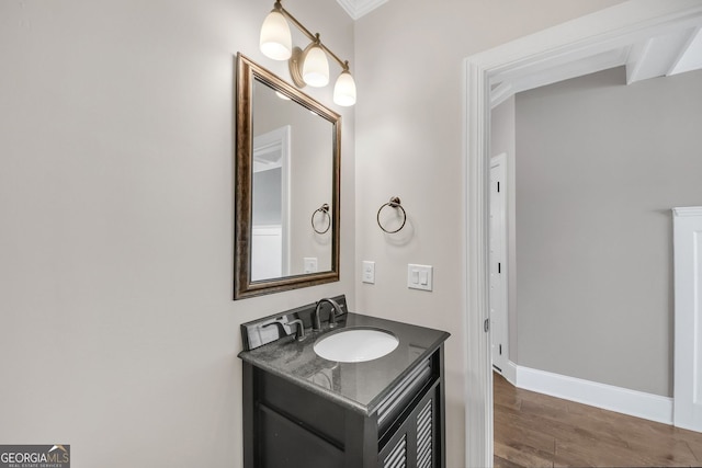 859 Heritage Lake Way, Grayson, GA 30017 - bathroom with vanity, wood finished floors, crown molding, and baseboards