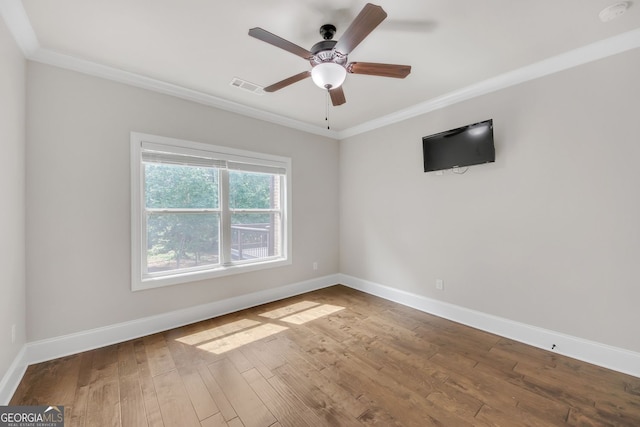 859 Heritage Lake Way, Grayson, GA 30017 - empty room featuring crown molding, baseboards, a smoke detector, ceiling fan, and wood finished floors