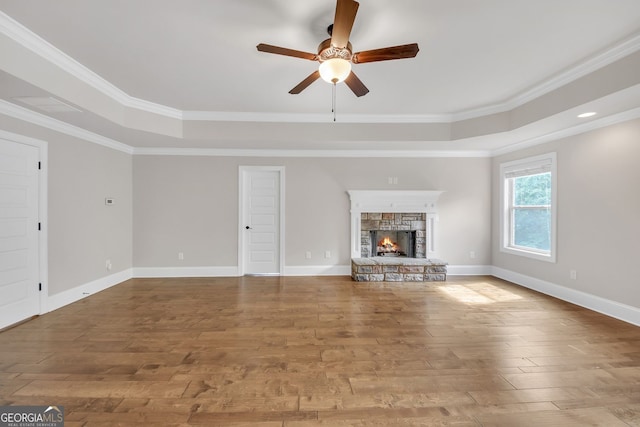 859 Heritage Lake Way, Grayson, GA 30017 - unfurnished living room with a tray ceiling, a ceiling fan, wood finished floors, and ornamental molding
