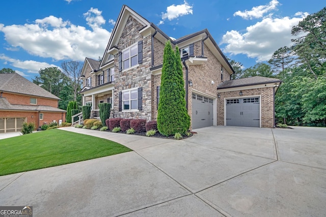 859 Heritage Lake Way, Grayson, GA 30017 - view of front of house featuring stone siding, concrete driveway, a front yard, and brick siding