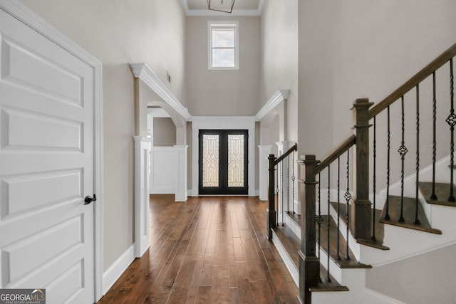 859 Heritage Lake Way, Grayson, GA 30017 - foyer entrance featuring a high ceiling, arched walkways, wood finished floors, french doors, and stairway