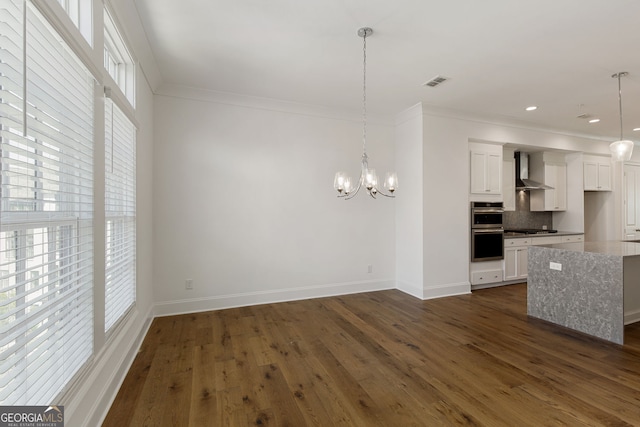 6790 Encore Blvd, Sandy Springs, GA 30328 - unfurnished living room featuring a chandelier, crown molding, dark wood finished floors, and recessed lighting