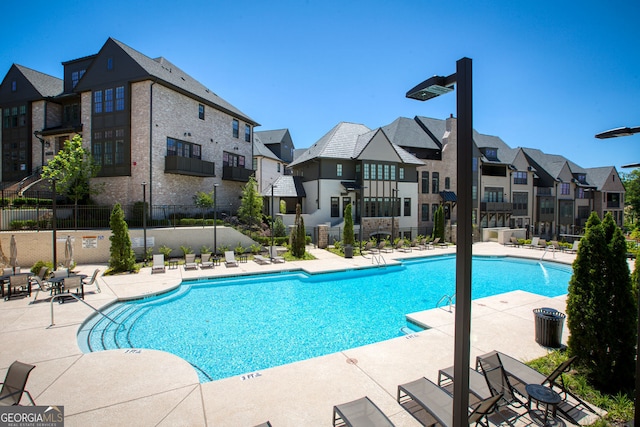 6790 Encore Blvd, Sandy Springs, GA 30328 - community pool featuring a residential view and a patio area