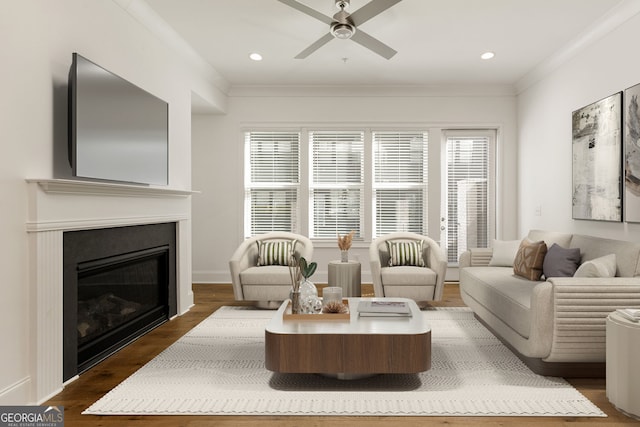 6790 Encore Blvd, Sandy Springs, GA 30328 - living room with a ceiling fan, dark wood-style flooring, a glass covered fireplace, recessed lighting, and ornamental molding
