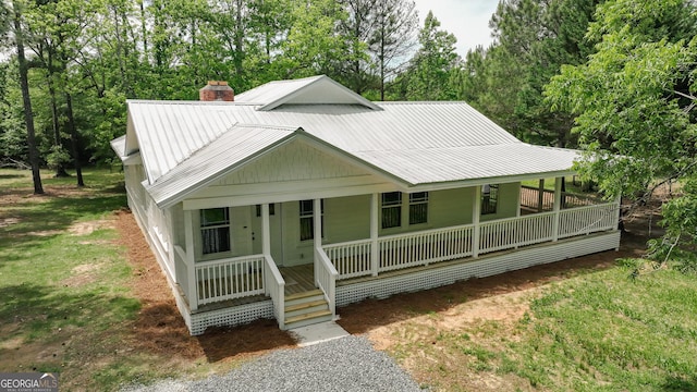 564 Bailey Mill Rd, Yatesville, GA 31097 - country-style home with a porch, a metal roof, and a chimney