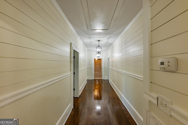564 Bailey Mill Rd, Yatesville, GA 31097 - hallway with attic access, dark wood finished floors, ornamental molding, and wooden walls