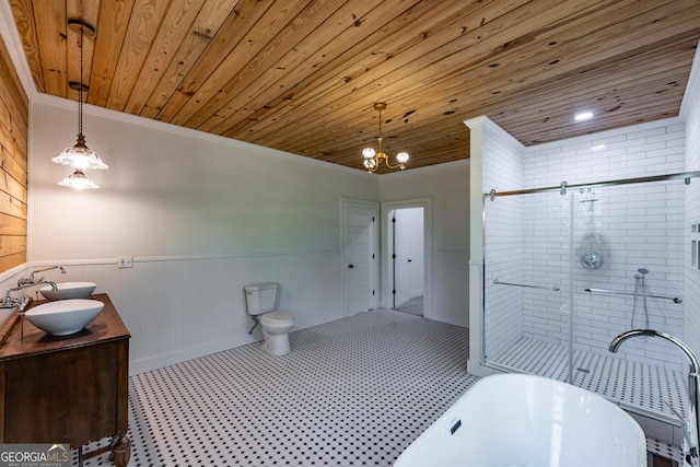 564 Bailey Mill Rd, Yatesville, GA 31097 - full bathroom with wood ceiling, a freestanding bath, double vanity, a wainscoted wall, and a chandelier