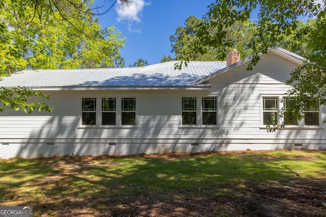 564 Bailey Mill Rd, Yatesville, GA 31097 - rear view of house featuring crawl space, a chimney, a lawn, and a metal roof