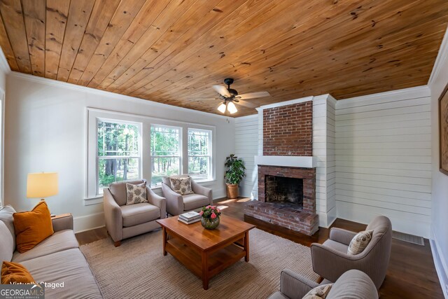 564 Bailey Mill Rd, Yatesville, GA 31097 - living area with wood ceiling, a ceiling fan, crown molding, wood finished floors, and a fireplace