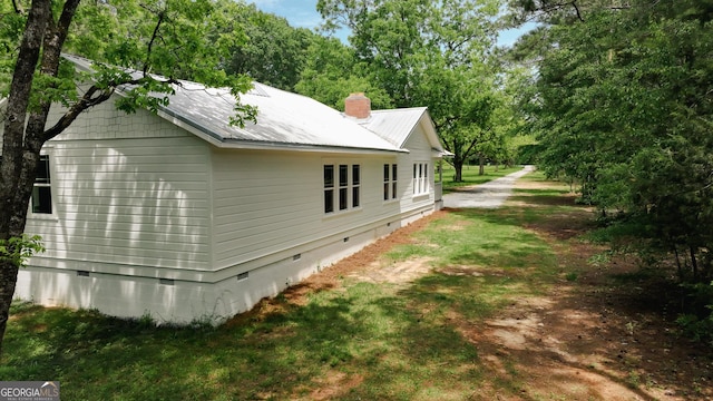 564 Bailey Mill Rd, Yatesville, GA 31097 - view of side of property featuring crawl space, a metal roof, and a chimney