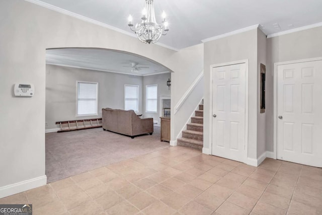 392 Vine St NW, Atlanta, GA 30314 - entrance foyer with light colored carpet, arched walkways, a ceiling fan, ornamental molding, and stairs