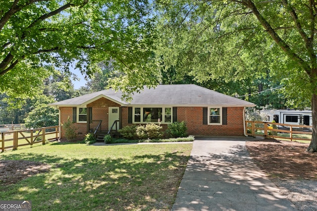 4027 Finch Rd SW, Powder Springs, GA 30127 - ranch-style home featuring brick siding and driveway