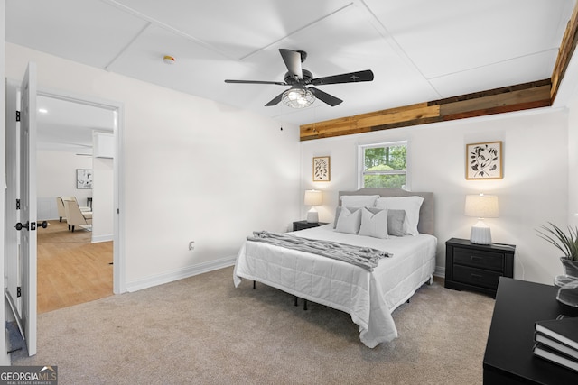 bedroom with carpet, baseboards, and ceiling fan